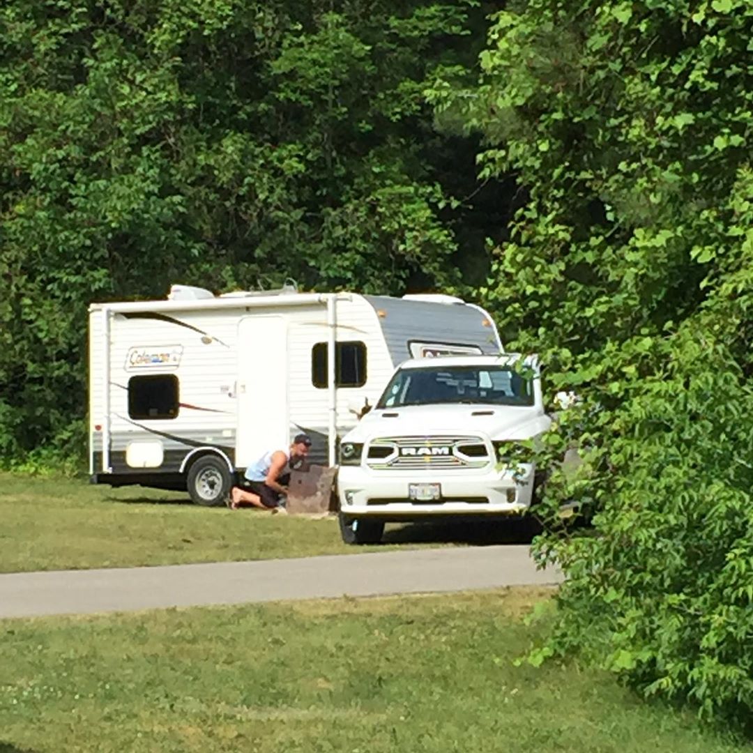 These folks were leaving the site next to ours and nearly tipped their trailer over.  Then they ran over the still smoking fire pit. #roughmorning #ladiesflight #skinnerco